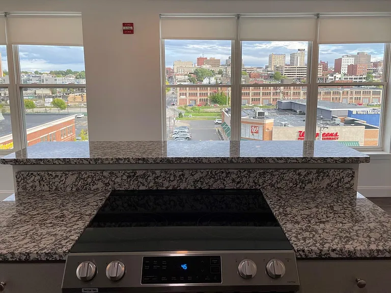 The view from the kitchen island in apartment 425 - The Linden's special top floor, corner one-bedroom with amazing city and Back Cove views!