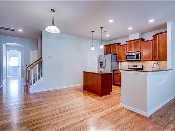 Granite counters, tile backsplash, large island and stainless appliances.