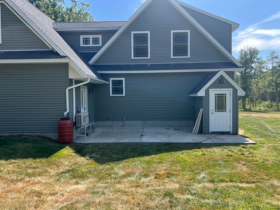 Back house with concrete patio to be shared space. Basement door will be second floor rentals space sectioned off in dry basement.