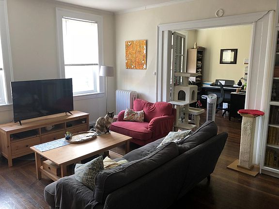 Living room with view of second bedroom (currently used as a