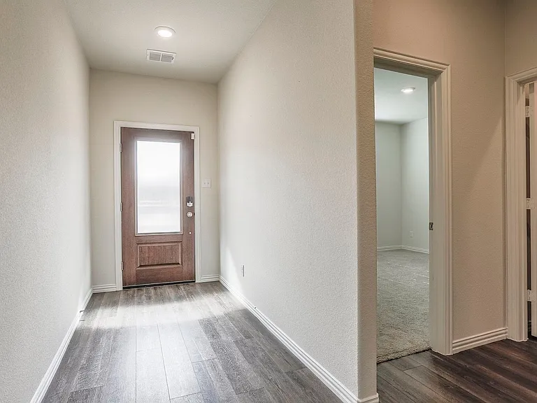 Entryway with dark wood-type flooring