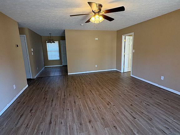 Living room with view of eating area in kitchen.