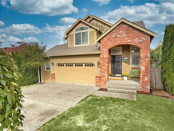 2-car garage and driveway space large enough for an additional two cars to park.