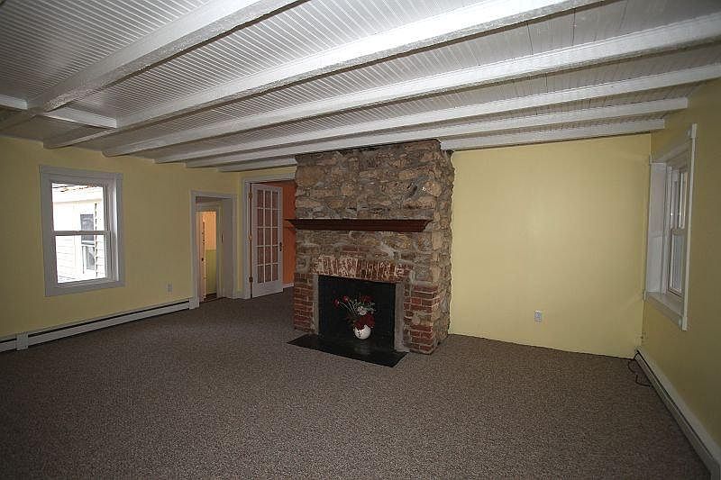 Living Room with ornamental fireplace