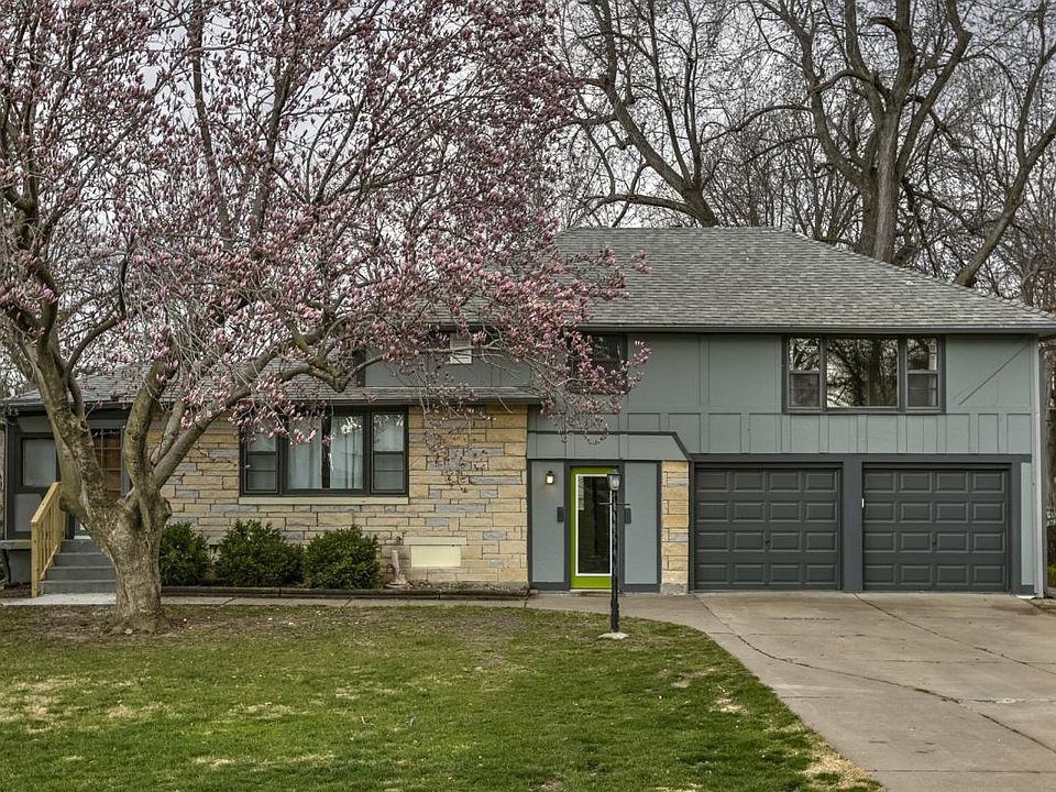 Duplex. Green door is entry. Right stall garage is included.