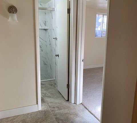 Hall from kitchen to bath and bedroom.