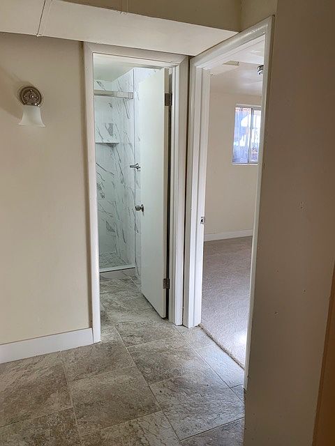 Hall from kitchen to bath and bedroom.