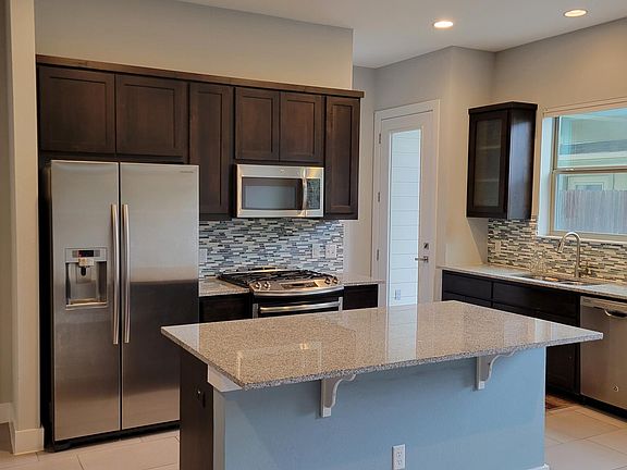 Another view of kitchen from breakfast/dining area
