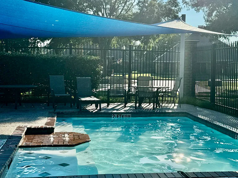 SHADED SPOT FOR PARENTS TO SIT UNDER IN THE BABY POOL AREA