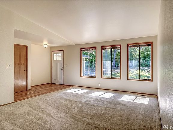 As you enter the home, you are welcomed by a bright and light living room. New carpet & flooring!