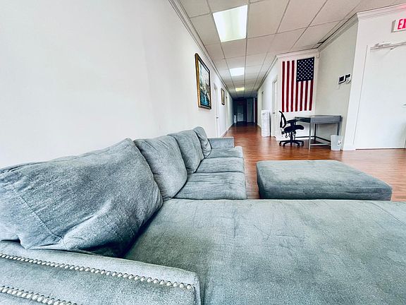 Living area with couch and study table.
