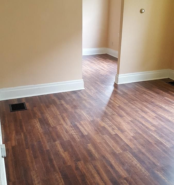 Living room area with separate room to back porch