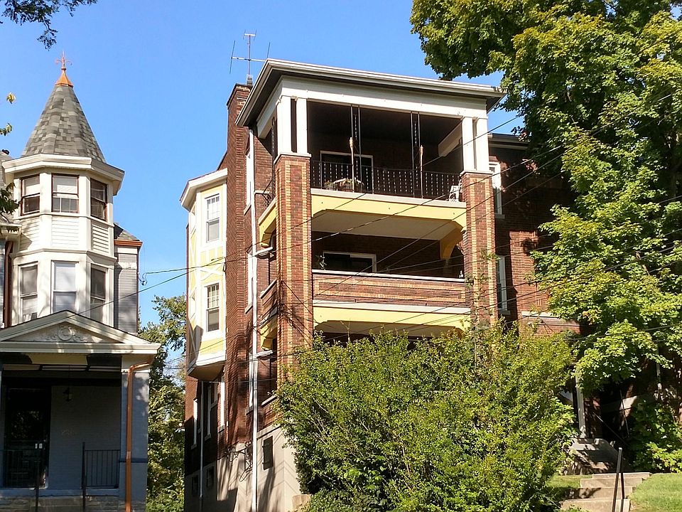 Historic building with three "flats" on lovely street near Eden Park (building on right).