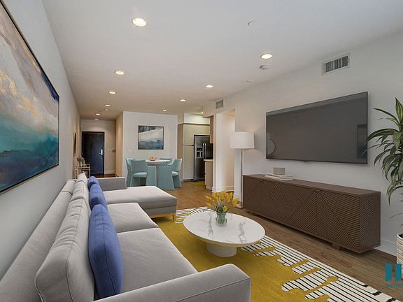 Open-Concept Dining and Living Room with Recessed Lighting and Vinyl Flooring