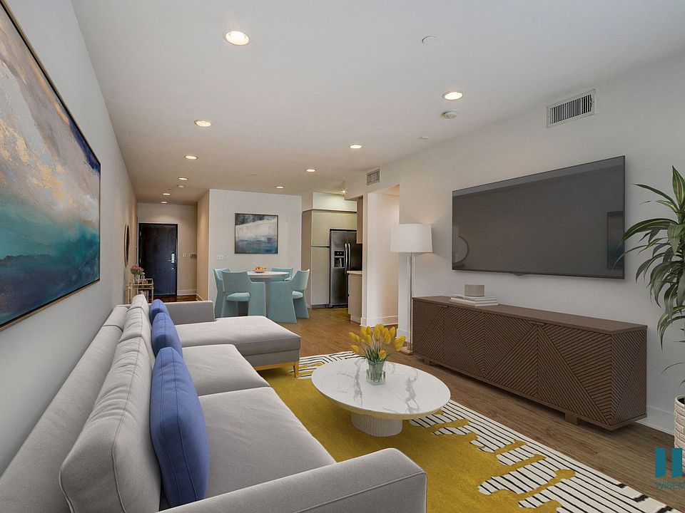 Open-Concept Dining and Living Room with Recessed Lighting and Vinyl Flooring