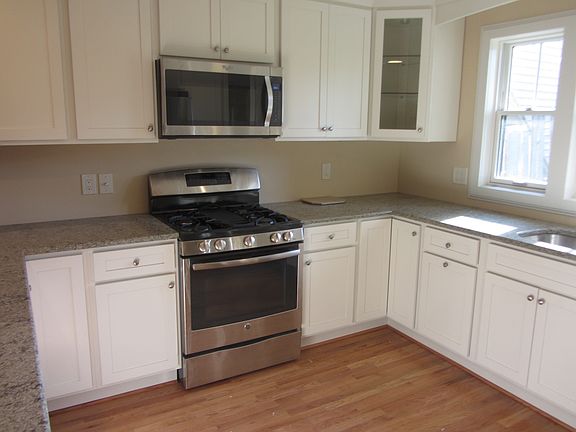 Kitchen - stove, microwave, quartz countertop