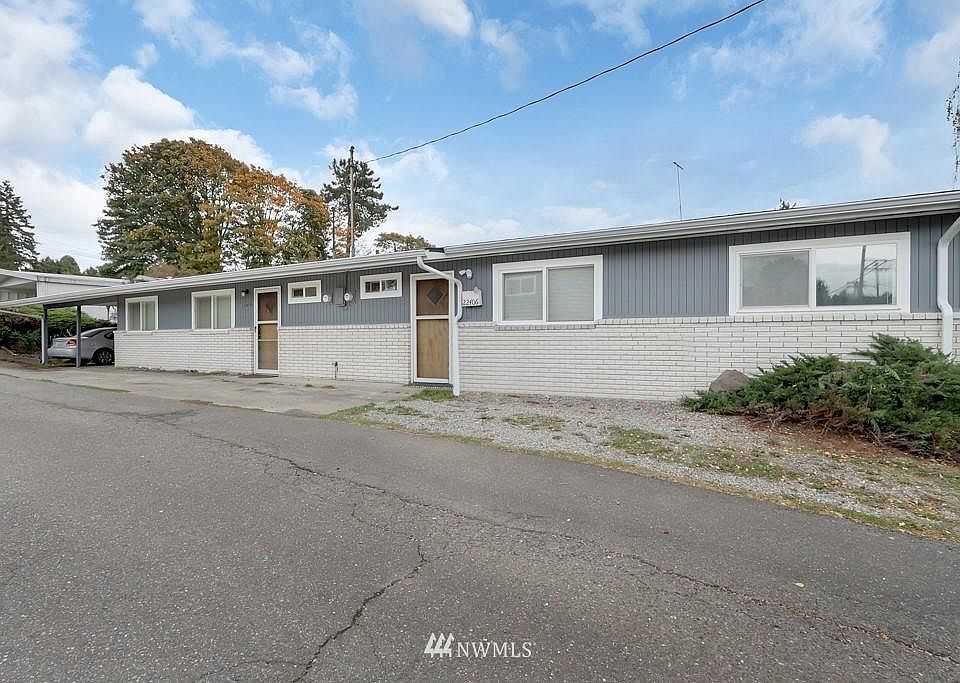 Front of duplex. Unit for rent is on the left in this photo, closest to the carport.