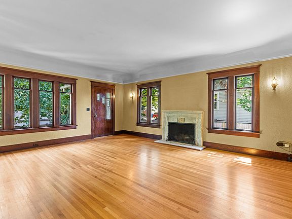 Huge living room with marble fireplace and built-ins. This house is so special - too many details lovingly restored to describe.