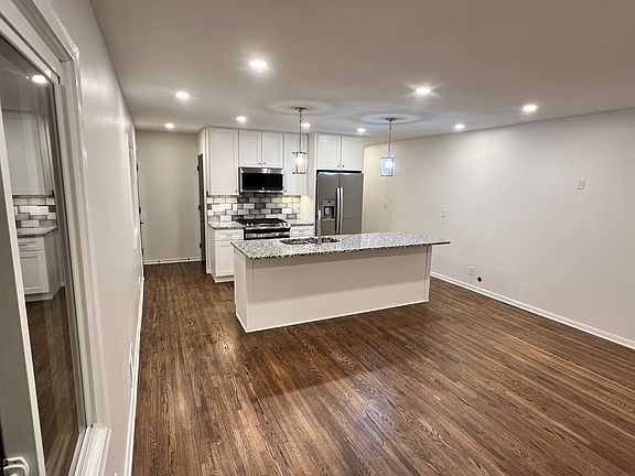 Amazing lighting with island pendants, kitchen, under cabinet, and living room all on separate switches with dimmers. It can be very well lit or dimmed as you like. Window now has blinds installed.