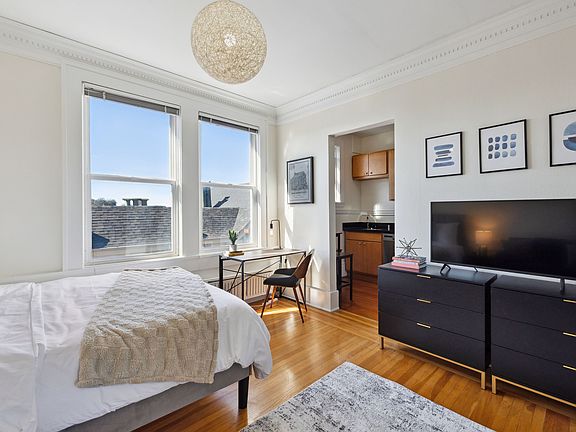 West facing windows above neighboring building provides abundant natural light.