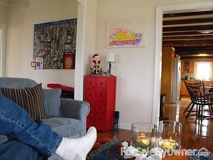 Living room view towards dining room
						:
						Hardwood floors, open feel.