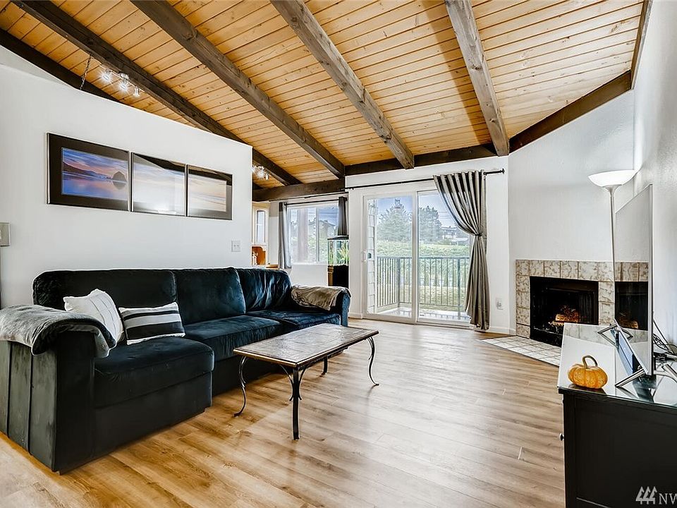 Beautiful living room with soaring vaulted ceiling and great Natural light 
