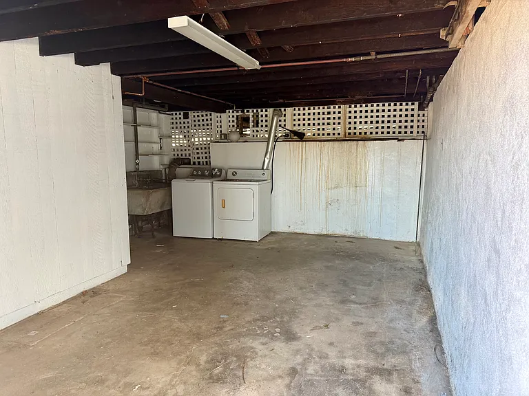 Convenient laundry area with ample room for additional storage