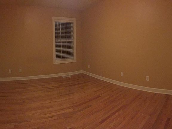 Downstairs bedroom with hardwood and double closet
