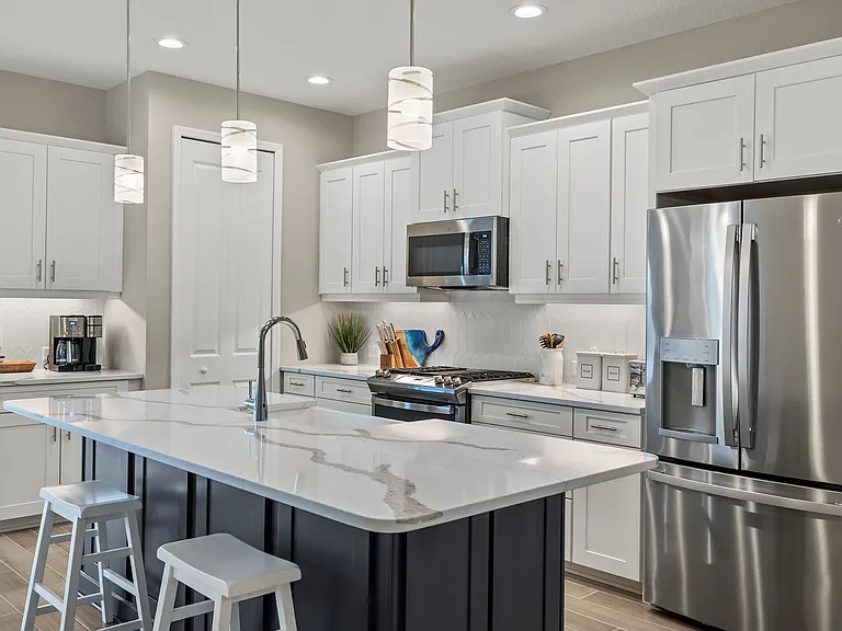 An abundance of kitchen cabinets plus a pantry and "coffee bar."
