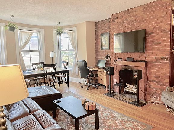 Living/Dining Room w/ Decorative Fireplace