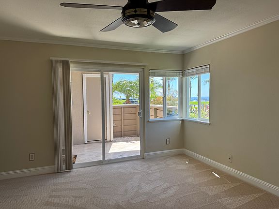 View of living room/master BR patio from master bedroom, walk in outside storage closet, Pacific Ocean.