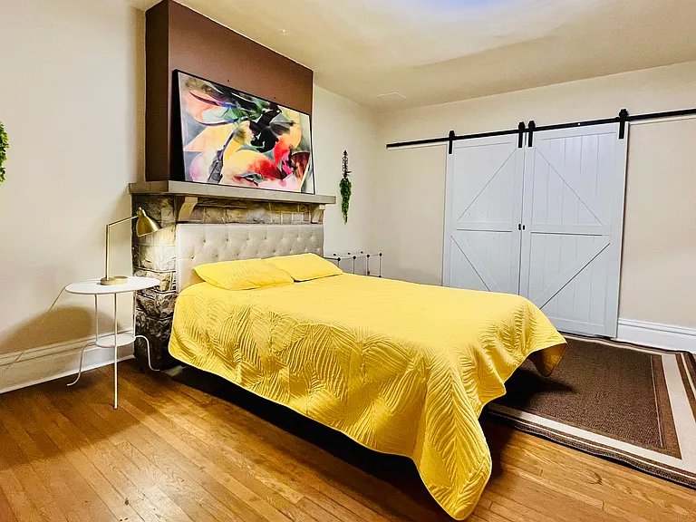 Beautiful double sliding barn doors add more privacy and character to the space