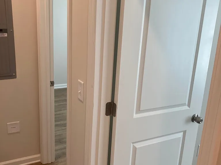 Two additional bedrooms are on the right of the hallway with the Master Bedroom on the left