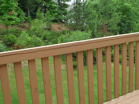 Deck overlooks private backyard