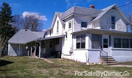View of the rear covered porches/patio
						:
						View of the rear covered porches and patio area