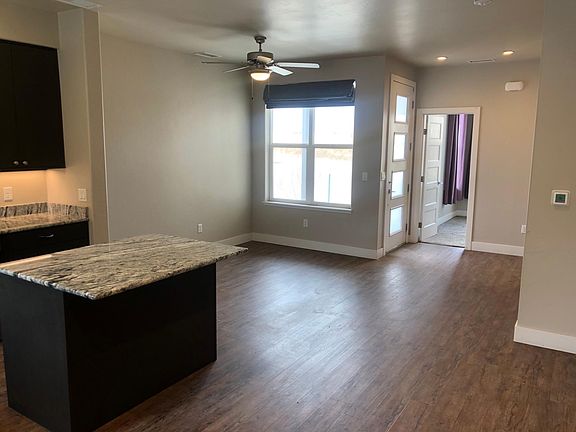 Main floor looking from staircase towards front of house