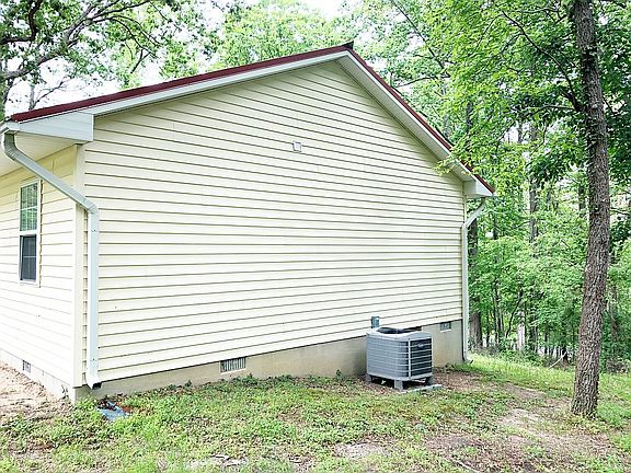 A/C unit and side of house 