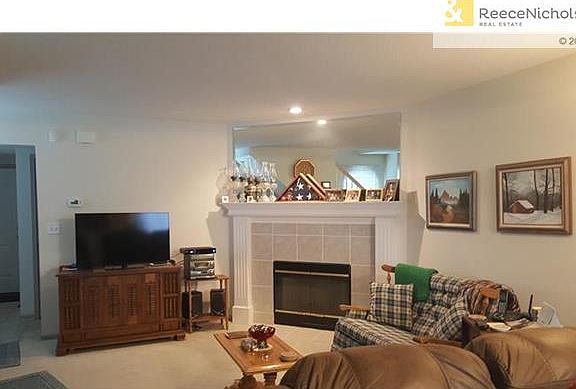 Very spacious living room with fireplace open to the kitchen