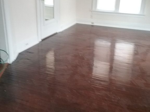 Large, bright living room with Cherry finished hardwood floo