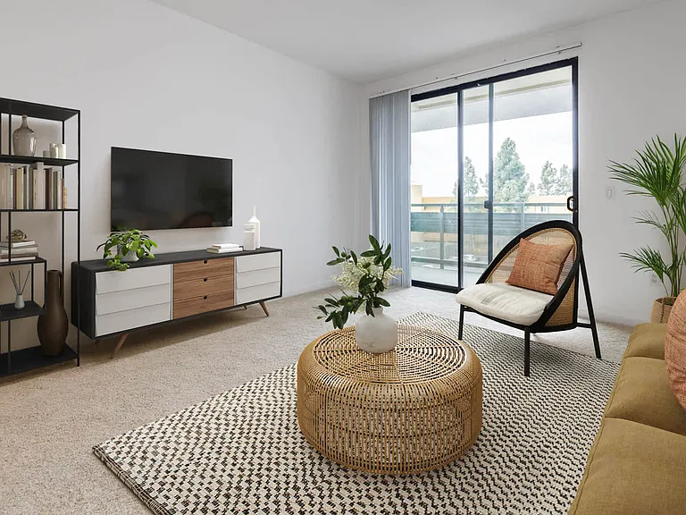 Carpeted Living Room with Balcony
