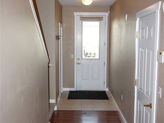Front door with garage entrance to the right. Lots of storage under the stairwell!