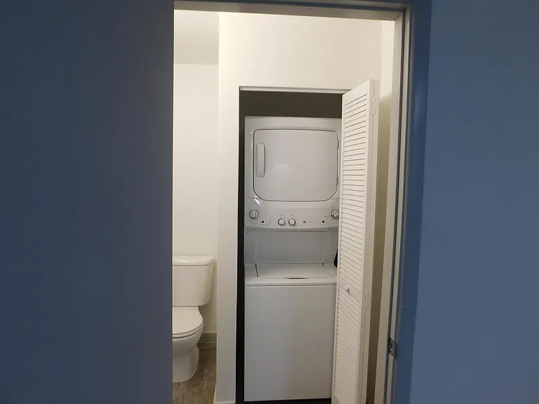 Second bedroom one-half bath with stack washer and dryer.