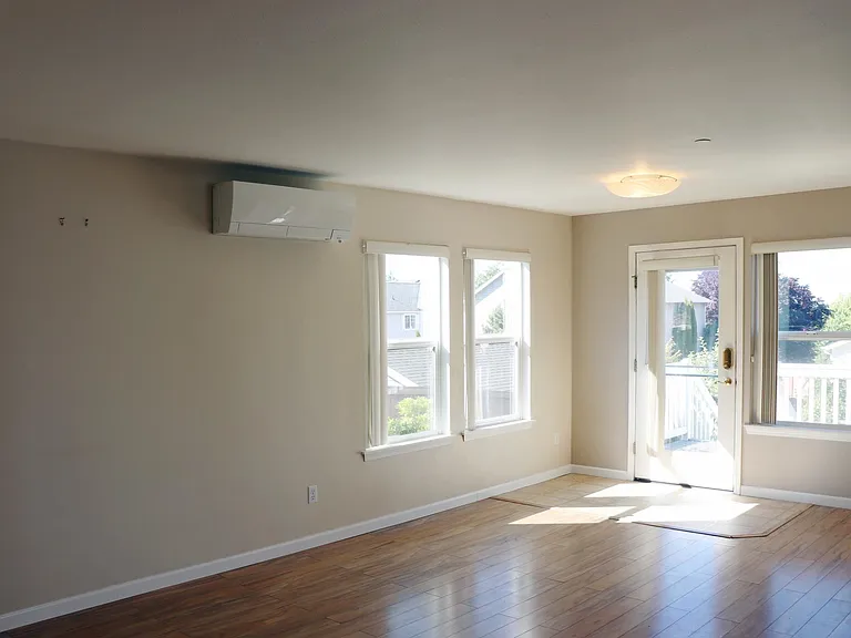 Living room with natural light and heat pump