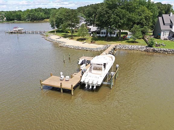 Cottage on left. Picture taken before second 15K boat lift was added on the left side of pier