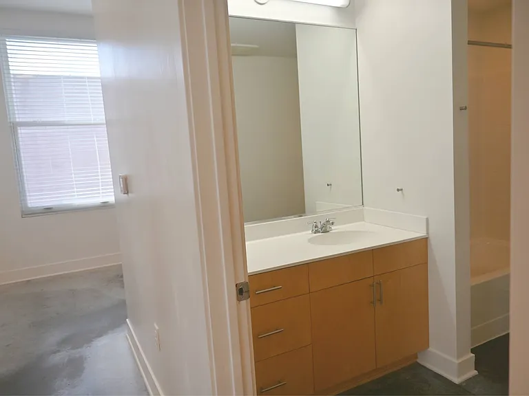 Large mirror with over bathroom vanity at The Sawyer.