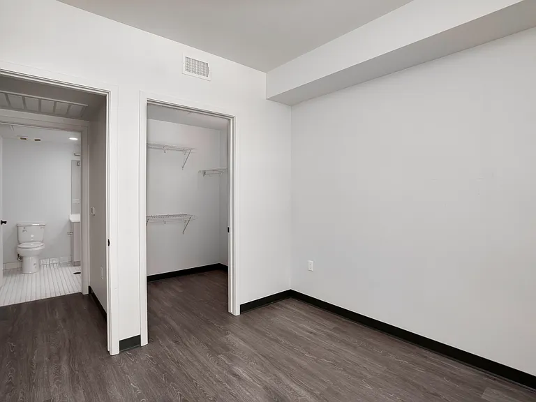 Bedroom B with generous closet space and convenient access to the hallway bathroom.