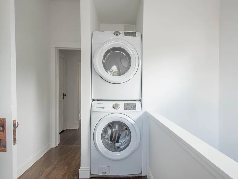Washer dryer in back of house behind guest bathroom and adjacent to master bedroom.
