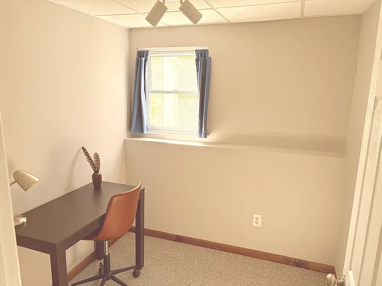 Bright, quiet office (downstairs) with a dedicated workstation and a door that can be locked for privacy