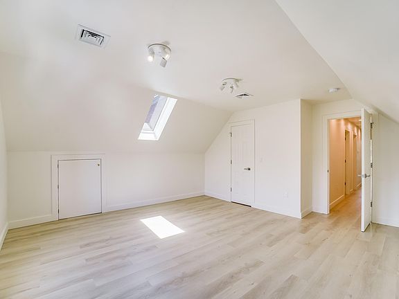 Super large Master Bedroom with tons of storage space and skylight