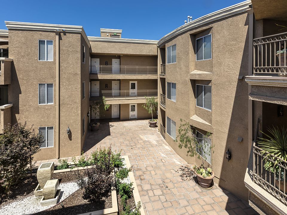 Apartments in Sherman Oaks, CA - Balcony View of Courtyard and Surrounding Apartment Buildings